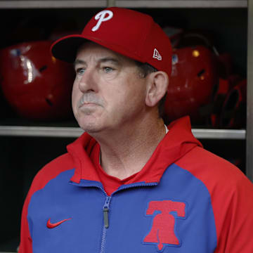 Jun 6, 2025; Pittsburgh, Pennsylvania, USA;  Philadelphia Phillies manager Rob Thomson (59) looks on from the dugout against the Pittsburgh Pirates at PNC Park. 