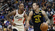 Jan 9, 2025; Detroit, Michigan, USA;  Golden State Warriors forward Lindy Waters III (43) dribbles against Detroit Pistons forward Ronald Holland II (00) in the second half at Little Caesars Arena. Mandatory Credit: Rick Osentoski-Imagn Images