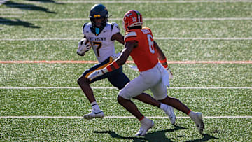Oct 5, 2024; Stillwater, Oklahoma, USA; West Virginia Mountaineers wide receiver Traylon Ray (7) runs the ball against Oklahoma State Cowboys safety Lyrik Rawls (6) during the third quarter at Boone Pickens Stadium. Mandatory Credit: William Purnell-Imagn Images