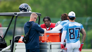Tennessee Titans players, from second left, Cam Ward (1), Tyjae Spears (2) and Xavier Restrepo (87) during OTAs at Ascension Saint Thomas Sports Park in Nashville, Tenn., Wednesday, May 28, 2025.