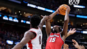 Mar 23, 2024; Salt Lake City, UT, USA; Dayton Flyers forward DaRon Holmes II (15) shoots against Arizona Wildcats guard Jaden Bradley (0) and guard KJ Lewis (5) during the second half in the second round of the 2024 NCAA Tournament at Vivint Smart Home Arena-Delta Center. Mandatory Credit: Rob Gray-USA TODAY Sports