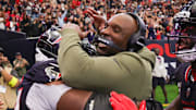 Nov 9, 2025; Houston, Texas, USA; Houston Texans head coach DeMeco Ryans jumps into the arms of defensive tackle Sheldon Rankins (90) following a game against the Jacksonville Jaguars at NRG Stadium. Mandatory Credit: Thomas Shea-Imagn Images
