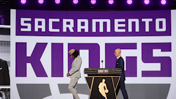 Jun 26, 2024; Brooklyn, NY, USA; Devin Carter walks on stage after being selected in the first round by the Sacramento Kings in the 2024 NBA Draft at Barclays Center. Mandatory Credit: Brad Penner-Imagn Images
