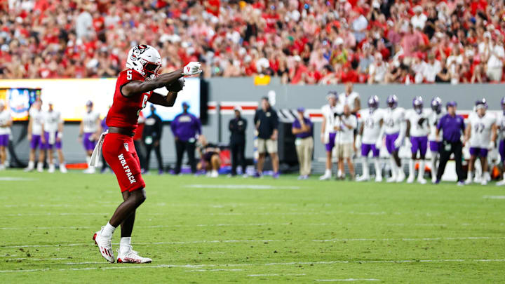 Aug 29, 2024; Raleigh, North Carolina, USA;   North Carolina State Wolfpack wide receiver Noah Rogers (5) celebrates first half of the game against Western Carolina Catamounts at Carter-Finley Stadium. Mandatory Credit: Jaylynn Nash-Imagn Images