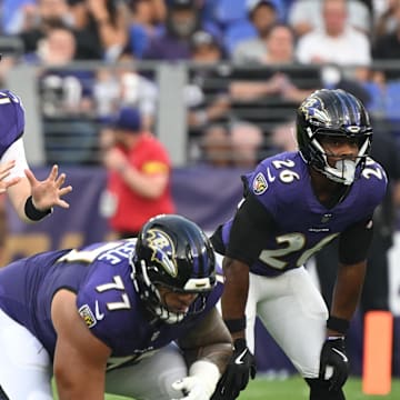 Aug 7, 2025; Baltimore, Maryland, USA; Baltimore Ravens quarterback Cooper Rush (15) awaits the snap against the Indianapolis Colts during the first quarter at M&T Bank Stadium. Mandatory Credit: Rafael Suanes-Imagn Images