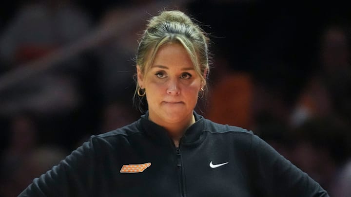 Tennessee women's basketball coach Kim Caldwell stands on the sidelines during a game.
