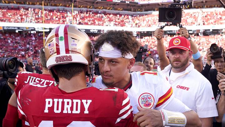 Kansas City Chiefs quarterback Patrick Mahomes (15) meets with San Francisco 49ers quarterback Brock Purdy (13)