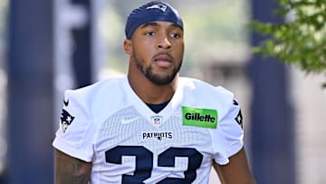 Jul 23, 2025; Foxborough, MA, USA; New England Patriots running back TreVeyon Henderson (32) walks to the practice field for training camp at Gillette Stadium. Mandatory Credit: Eric Canha-Imagn Images