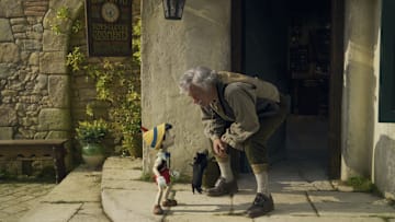 (L-R): Pinocchio (voiced by Benjamin Evan Ainsworth), Figaro, and Tom Hanks as Geppetto in Disney's live-action PINOCCHIO, exclusively on Disney+. Photo courtesy of Disney Enterprises, Inc. © 2022 Disney Enterprises, Inc. All Rights Reserved.