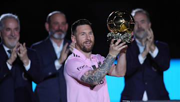 Messi poses with the Ballon d'Or trophy before a game against New York City FC.