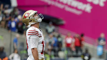 San Francisco 49ers quarterback Brock Purdy (13) celebrates after throwing a touchdown pass against the Seattle Seahawks during the fourth quarter at Lumen Field. 