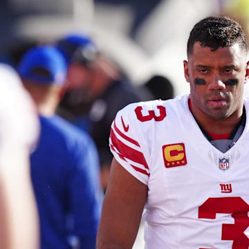 Oct 19, 2025; Denver, Colorado, USA; New York Giants quarterback Russell Wilson (3) looks on from the sidelines during the second half against the Denver Broncos at Empower Field at Mile High.