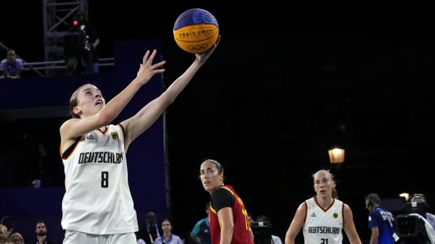 Germany player Elisa Mevius (8) shoots the ball against Spain player Vega Gimeno (11) in the women’s 3x3 gold medal game