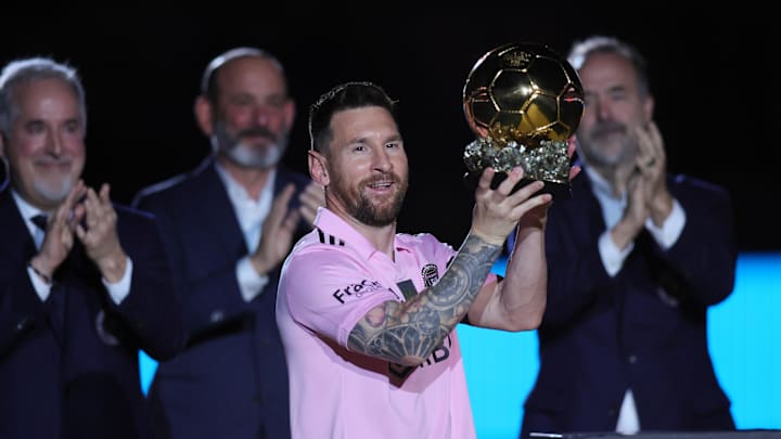 Messi poses with the Ballon d'Or trophy before a game against New York City FC.