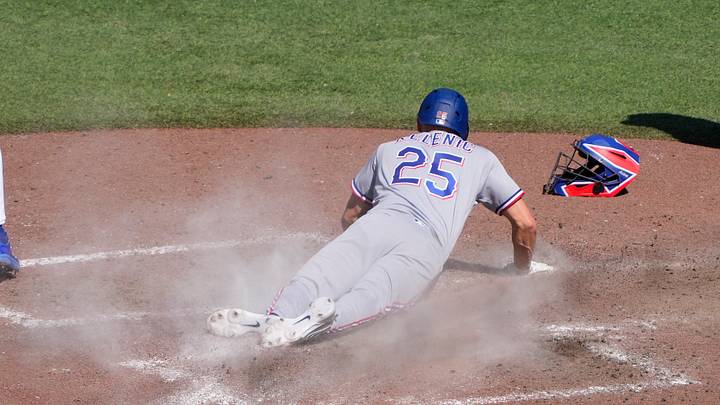 Jun 28, 2026; Toronto, Ontario, CAN; Texas Rangers pinch runner Jarred Kelenic (25) scores on a wild pitch against the Toronto Blue Jays during the ninth inning at Rogers Centre. Mandatory Credit: John E. Sokolowski-Imagn Images