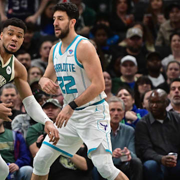 Feb 27, 2024; Milwaukee, Wisconsin, USA; Milwaukee Bucks forward Giannis Antetokounmpo (34) gets pressure from Charlotte Hornets guard Vasilije Micic (22) in the second quarter at Fiserv Forum. Mandatory Credit: Benny Sieu-Imagn Images