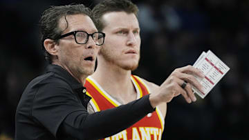 Atlanta Hawks head coach Quin Snyder directs forward Garrison Mathews (24) during a free throw in the first quarter against the Minnesota Timberwolves at Target Center.