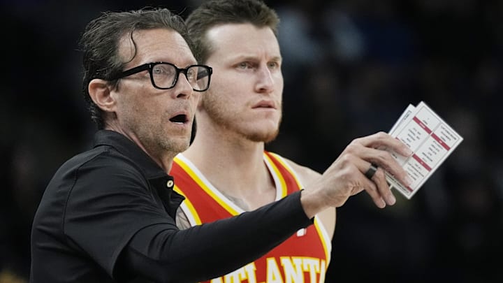 Atlanta Hawks head coach Quin Snyder directs forward Garrison Mathews (24) during a free throw in the first quarter against the Minnesota Timberwolves at Target Center.