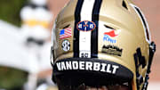Nov 19, 2022; Nashville, Tennessee, USA; View of stickers on the helmet of Vanderbilt Commodores offensive lineman Duncan MacDonald (60) to honor the Virginia players who died in a shooting at FirstBank Stadium. Mandatory Credit: Christopher Hanewinckel-Imagn Images