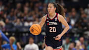 Apr 4, 2025; Tampa, FL, USA;  Connecticut Huskies guard Kaitlyn Chen (20) dribbles against the UCLA Bruins during the fourth quarter in a semifinal of the women's 2025 NCAA tournament at Amalie Arena. Mandatory Credit: Nathan Ray Seebeck-Imagn Images