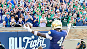 Oct 12, 2024; South Bend, Indiana, USA; Fans react after Notre Dame Fighting Irish running back Jeremiyah Love (4) ran for a touchdown in the third quarter against the Stanford Cardinal at Notre Dame Stadium. 