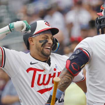 Jun 16, 2024; Minneapolis, Minnesota, USA; Minnesota Twins third baseman Royce Lewis (23) celebrates his three-run home run with shortstop Carlos Correa (4) against the Oakland Athletics in the first inning of game two of a double header at Target Field. Mandatory Credit: Bruce Kluckhohn-USA TODAY Sports