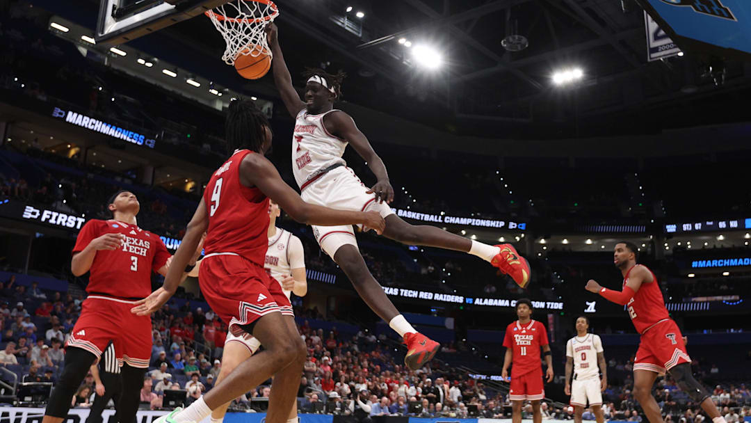Mar 22, 2026; Tampa, FL, USA; Alabama Crimson Tide forward Taylor Bol Bowen (7) dunks the ball past Texas Tech Red Raiders forward Luke Bamgboye (9) in the second half during a second round game of the men's 2026 NCAA Tournament at Benchmark International Arena. 