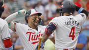 Jun 16, 2024; Minneapolis, Minnesota, USA; Minnesota Twins third baseman Royce Lewis (23) celebrates his three-run home run with shortstop Carlos Correa (4) against the Oakland Athletics in the first inning of game two of a double header at Target Field. Mandatory Credit: Bruce Kluckhohn-USA TODAY Sports