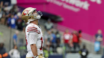 Sep 7, 2025; Seattle, Washington, USA; San Francisco 49ers quarterback Brock Purdy (13) celebrates after throwing a touchdown pass against the Seattle Seahawks during the fourth quarter at Lumen Field. Mandatory Credit: Joe Nicholson-Imagn Images