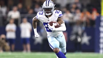Dec 22, 2024; Arlington, Texas, USA; Dallas Cowboys running back Rico Dowdle (23) runs the ball against the Tampa Bay Buccaneers in the second half at AT&T Stadium. Mandatory Credit: Tim Heitman-Imagn Images