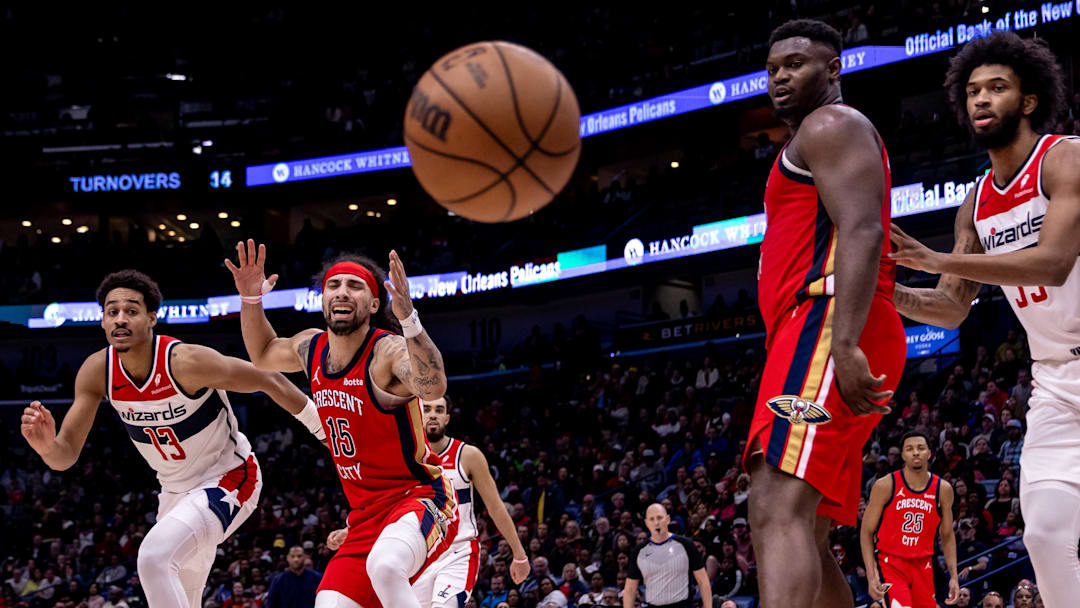 Feb 14, 2024; New Orleans, Louisiana, USA; Washington Wizards guard Jordan Poole (13) knocks the ball away from New Orleans Pelicans guard Jose Alvarado (15)  out of bounds during the second half at Smoothie King Center. Mandatory Credit: Stephen Lew-Imagn Images