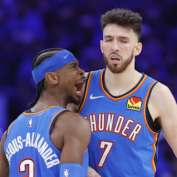 May 22, 2025; Oklahoma City, Oklahoma, USA; Oklahoma City Thunder guard Shai Gilgeous-Alexander (2) and forward Chet Holmgren (7) celebrate after a play against the Minnesota Timberwolves in the third quarter during game two of the western conference finals for the 2025 NBA Playoffs at Paycom Center. Mandatory Credit: Alonzo Adams-Imagn Images