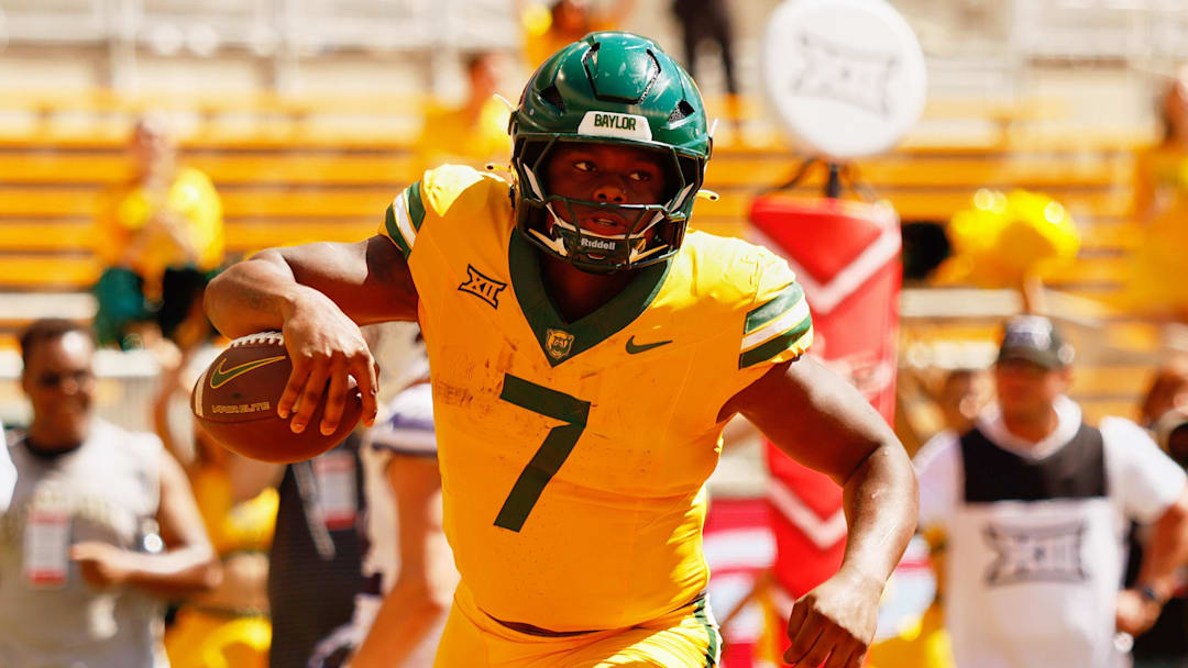 Oct 4, 2025; Waco, Texas, USA; Baylor Bears running back Bryson Washington (7) scores a rushing touchdown against the Kansas State Wildcats during the second half at McLane Stadium. Mandatory Credit: Chris Jones-Imagn Images