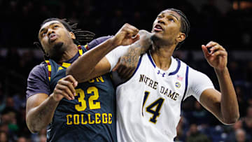 Boston College forward Chad Venning (32) and Notre Dame forward Kebba Njie (14) get tangled up during a free throw during a NCAA men's basketball game between Notre Dame and Boston College at Purcell Pavilion on Monday, Jan. 13, 2025, in South Bend.