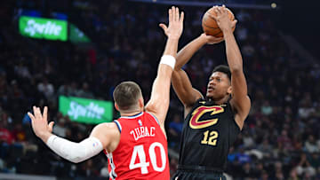 Mar 18, 2025; Inglewood, California, USA;  Cleveland Cavaliers forward De’Andre Hunter (12) shoots against Los Angeles Clippers center Ivica Zubac (40) during the first half at Intuit Dome. Mandatory Credit: Gary A. Vasquez-Imagn Images