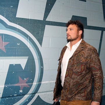 Dec 3, 2023; Nashville, Tennessee, USA; Tennessee Titans offensive tackle Dillon Radunz (75) walks to the locker room before the game against the Indianapolis Colts at Nissan Stadium. Mandatory Credit: Christopher Hanewinckel-Imagn Images