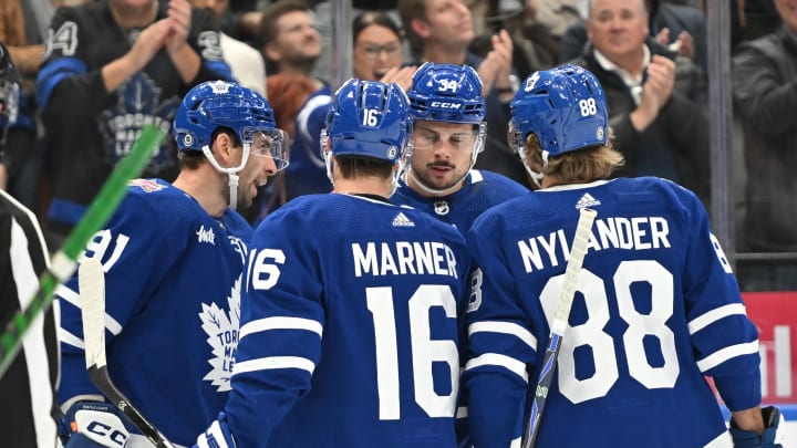 Oct 14, 2023; Toronto, Ontario, CAN;  Toronto Maple Leafs forward John Tavares (91) celebrates with forwards Mitchell Marner (16) and Auston Matthews (34) and William Nylander (88) after scoring a goal against the Minnesota Wild in the first  period at Scotiabank Arena. Mandatory Credit: Dan Hamilton-USA TODAY Sports