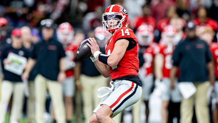 Jan 2, 2025; New Orleans, LA, USA;  Georgia Bulldogs quarterback Gunner Stockton (14) drops back to pass against against the Notre Dame Fighting Irish during the second half at Caesars Superdome. Mandatory Credit: Stephen Lew-Imagn Images