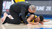 Jun 22, 2025; Oklahoma City, Oklahoma, USA; Indiana Pacers guard Tyrese Haliburton (0) reacts after suffering an injury during the first quarter against the Oklahoma City Thunder during game seven of the 2025 NBA Finals at Paycom Center. Mandatory Credit: Kyle Terada-Imagn Images