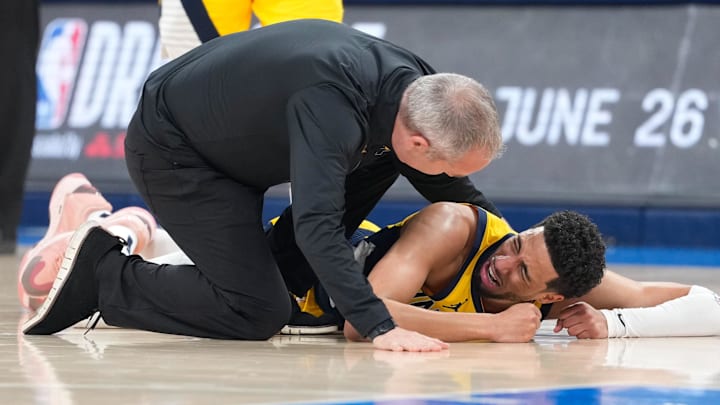 Jun 22, 2025; Oklahoma City, Oklahoma, USA; Indiana Pacers guard Tyrese Haliburton (0) reacts after suffering an injury during the first quarter against the Oklahoma City Thunder during game seven of the 2025 NBA Finals at Paycom Center. Mandatory Credit: Kyle Terada-Imagn Images