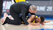 Jun 22, 2025; Oklahoma City, Oklahoma, USA; Indiana Pacers guard Tyrese Haliburton (0) reacts after suffering an injury during the first quarter against the Oklahoma City Thunder during game seven of the 2025 NBA Finals at Paycom Center. Mandatory Credit: Kyle Terada-Imagn Images