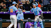 Jun 6, 2025; Denver, Colorado, USA; Colorado Rockies relief pitcher Jake Bird (59) reacts with catcher Hunter Goodman (15) in the sixth inning against the New York Mets at Coors Field. Mandatory Credit: Isaiah J. Downing-Imagn Images