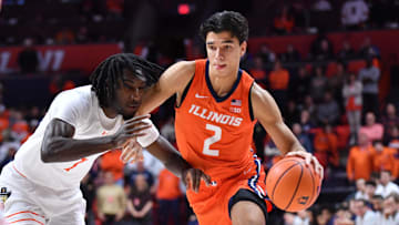 Nov 24, 2025; Champaign, Illinois, USA;  Illinois Fighting Illini guard Andrej Stojakovic (2) drives the ball against UT Rio Grande Valley Vaqueros forward Kye Dickson (7) during the first half at State Farm Center. Mandatory Credit: Ron Johnson-Imagn Images