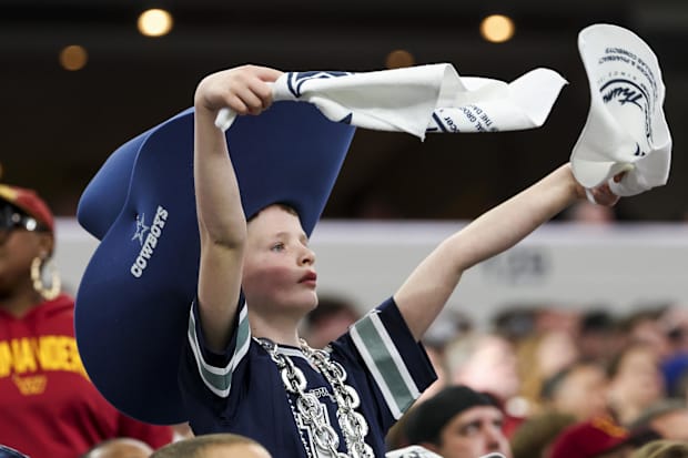 Dallas Cowboys fan cheers during the second half against the Washington Commanders.