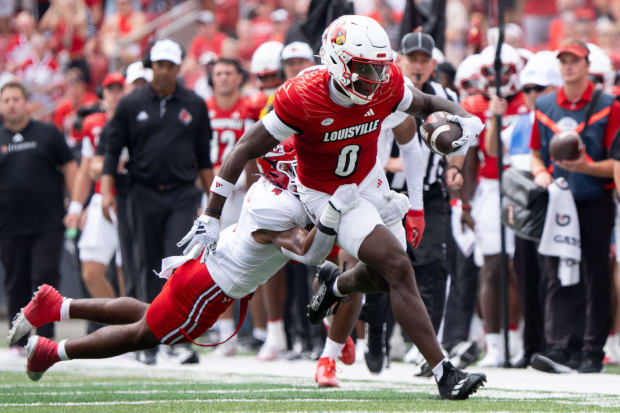 Louisville Cardinals wide receiver Chris Bell (0) runs down the field 