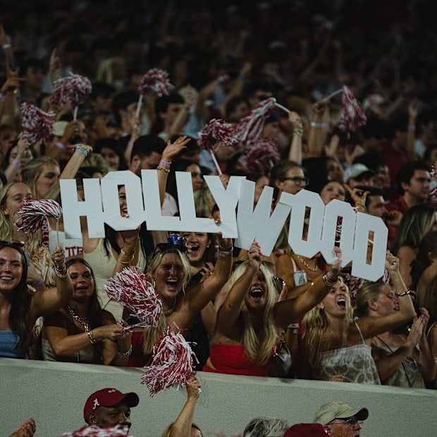 Alabama fans hold up a sign reading “Hollywood” for Alabama Crimson Tide wide receiver Ryan Williams.