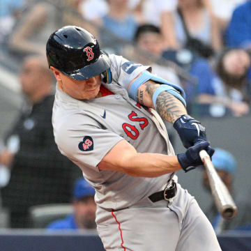 Boston Red Sox designated hitter Tyler O'Neill (17) hits a solo home run against the Toronto Blue Jays in the third inning at Rogers Centre on June 17.