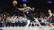 Oct 29, 2025; Brooklyn, New York, USA; Brooklyn Nets guard Terance Mann (14) saves the ball from going out of bounds in the fourth quarter against the Atlanta Hawks at Barclays Center. Mandatory Credit: Wendell Cruz-Imagn Images