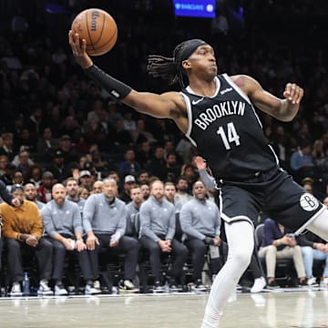 Oct 29, 2025; Brooklyn, New York, USA; Brooklyn Nets guard Terance Mann (14) saves the ball from going out of bounds in the fourth quarter against the Atlanta Hawks at Barclays Center. Mandatory Credit: Wendell Cruz-Imagn Images