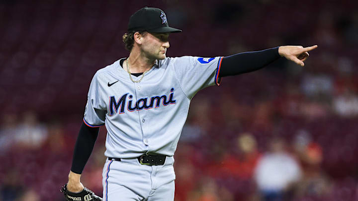 Jul 8, 2025; Cincinnati, Ohio, USA; Miami Marlins relief pitcher Josh Simpson (66) reacts after a play in the ninth inning against the Cincinnati Reds at Great American Ball Park. Mandatory Credit: Katie Stratman-Imagn Images